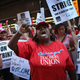 Chicago public school teachers and their supporters picket in front of the Chicago Public Schools (CPS) headquarters on September 11, 2012, in Chicago, Illinois. More than 26,000 teachers and support staff walked off their jobs yesterday after the Chicago Teachers Union failed to reach an agreement with the city on compensation, benefits, and job security.